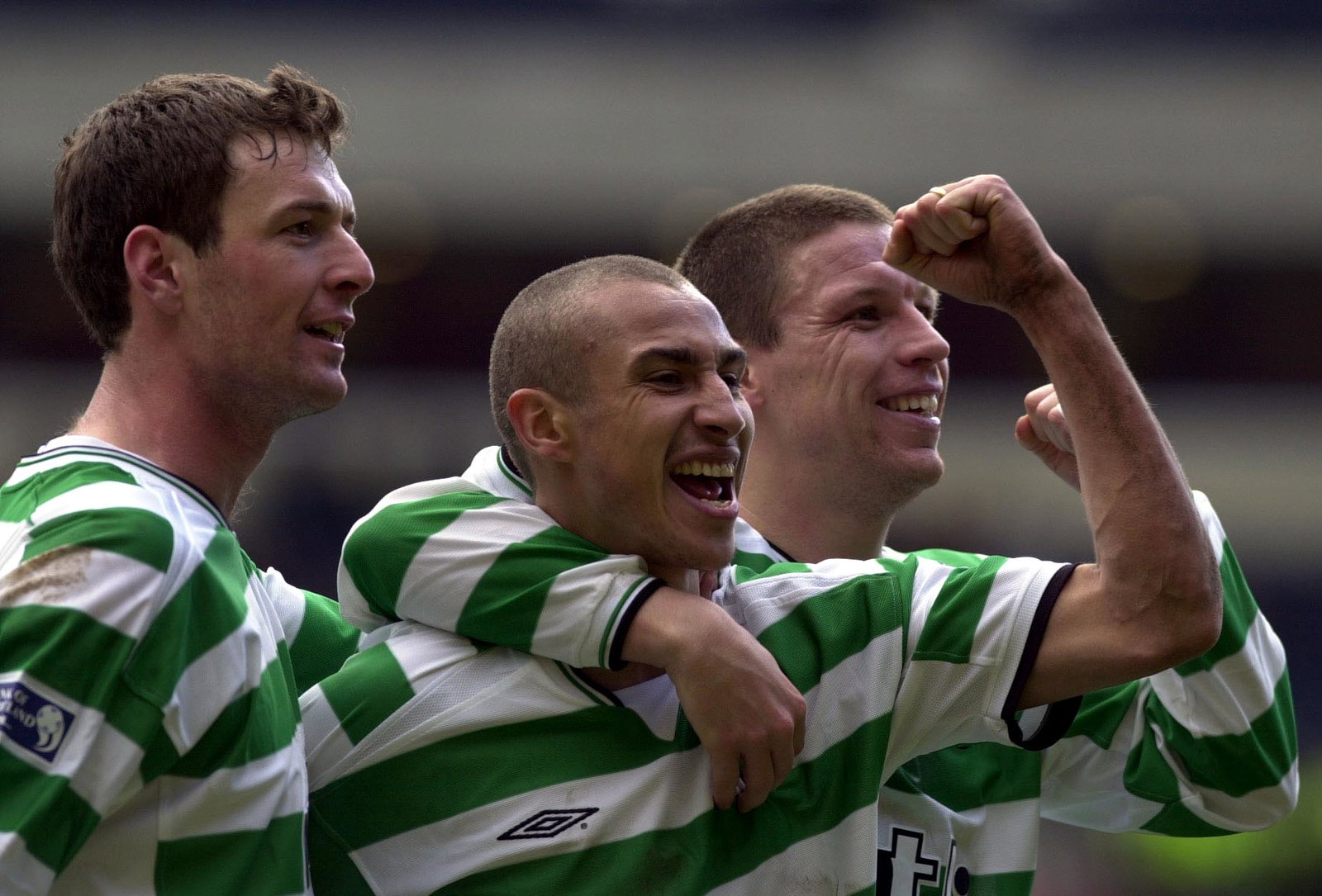Henrik Larsson celebrates with Alan Thompson and Chris Sutton