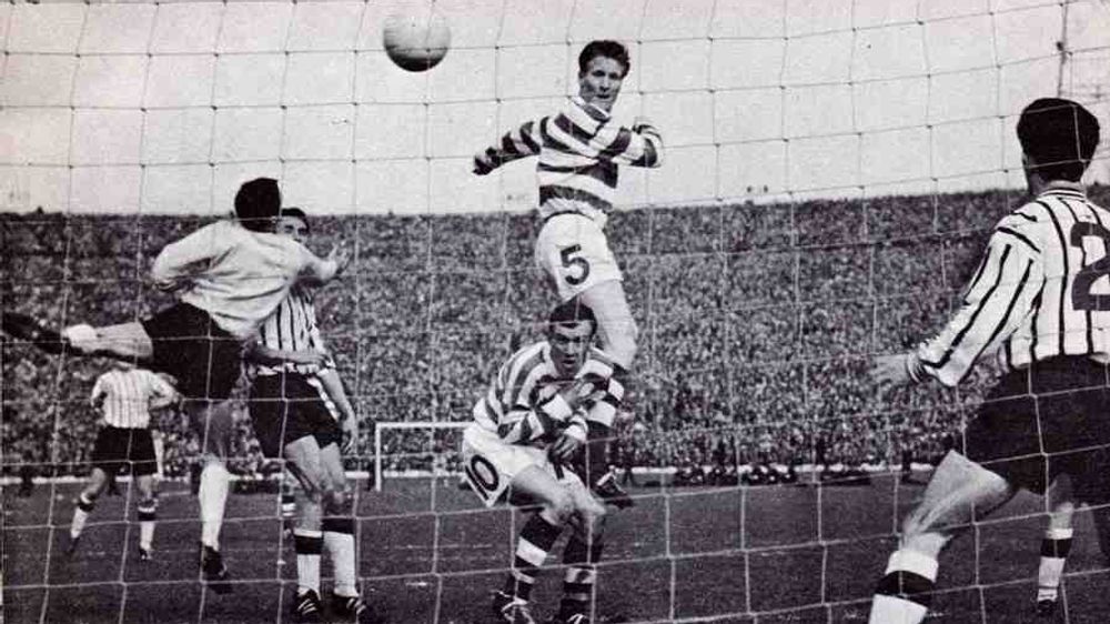 The Celtic Rising - Celtic captain Billy McNeill heads home the winner from a Charlie Gallagher corner in the 1965 Scottish Cup Final.