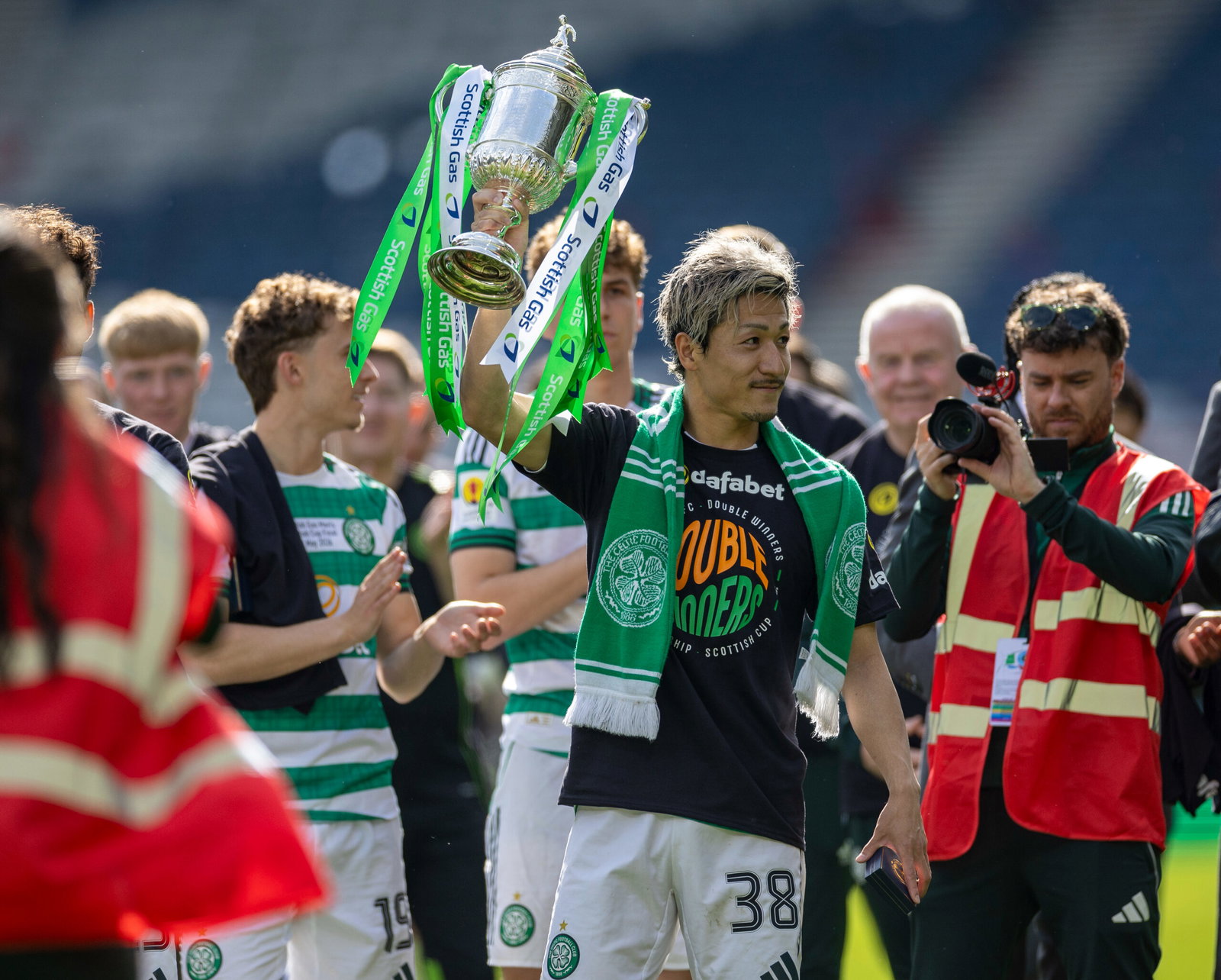 Daizen Maeda of Celtic with the trophy