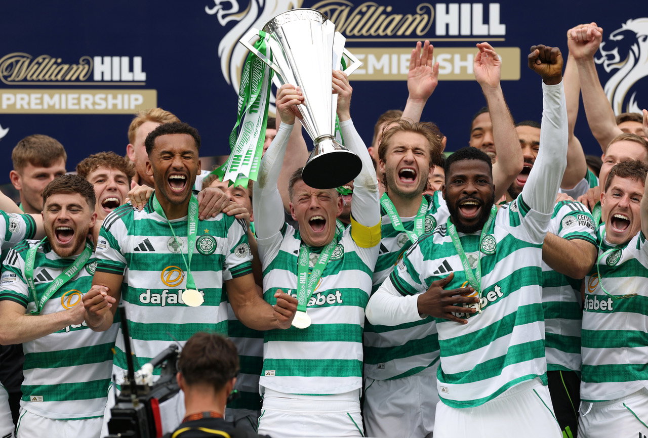 Callum McGregor of Celtic lifts the Scottish Premiership Trophy