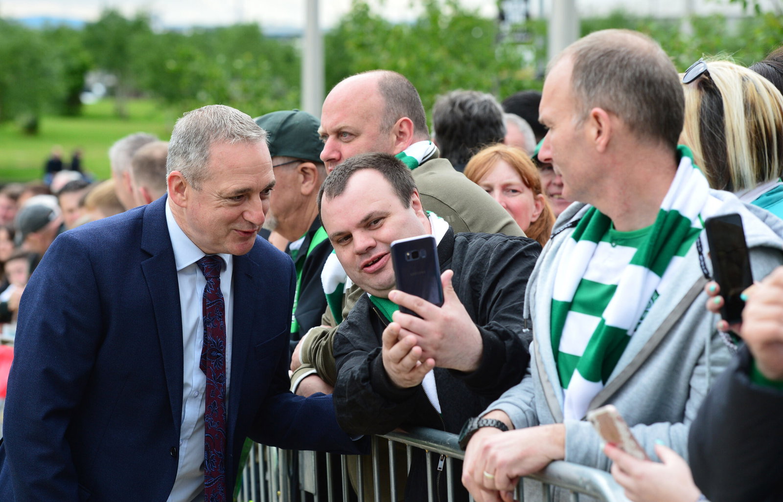 Celtic legend Paul McStay poses with fans 