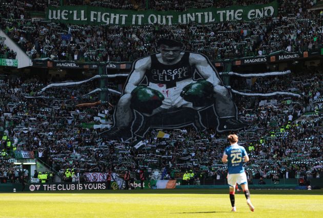 Fans of Celtic display a tifo which reads 'we'll fight it out until the end',