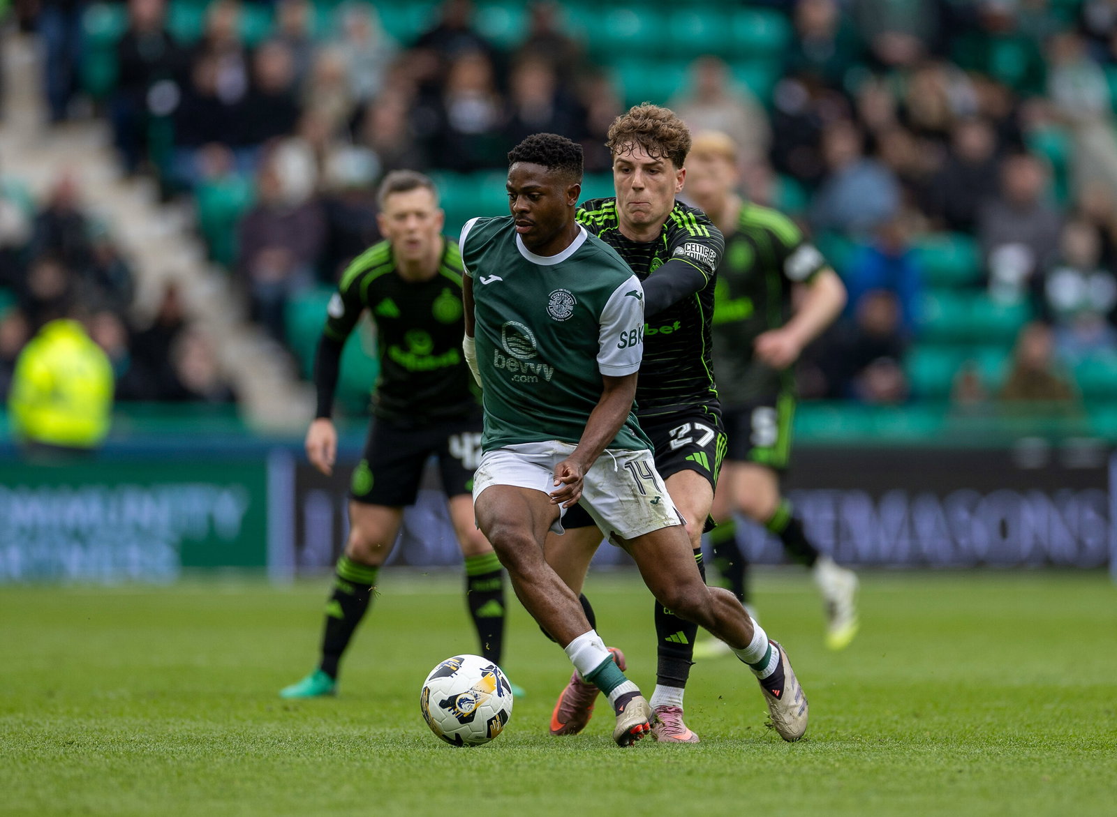 Arne Engels of Celtic challenges Miguel Chaiwa of Hibernian