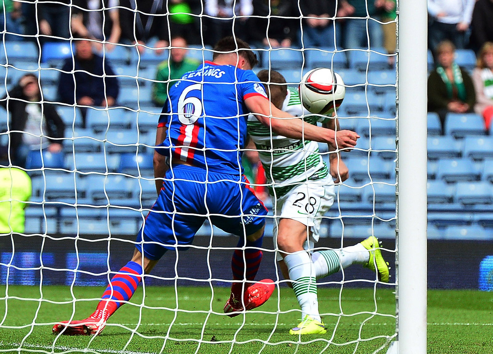 Josh Meekings of Caledonian Thistle handles the ball on the goal line