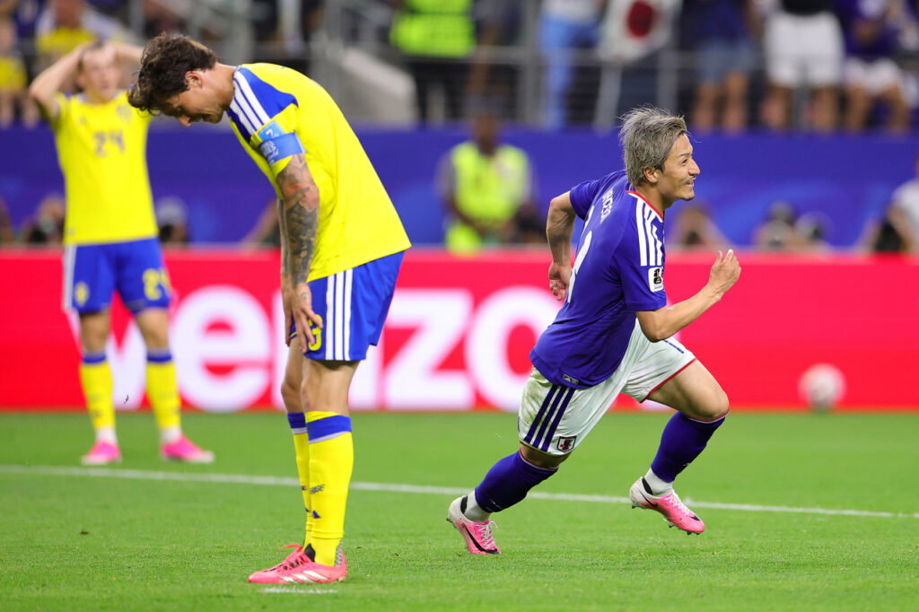 Daizen Maeda of Japan celebrates
