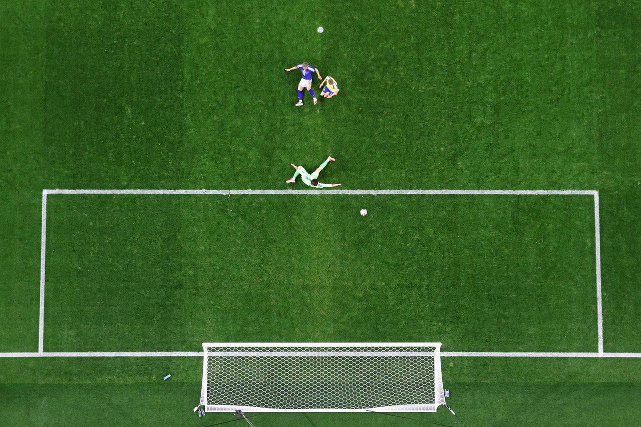 Daizen Maeda of Japan scores
