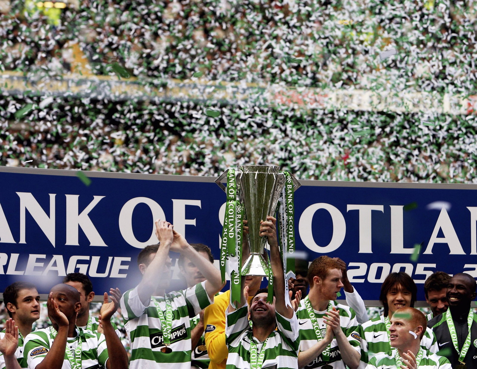 Maciej Zurawaski of Celtic is seen with the Scottish Premier division trophy 