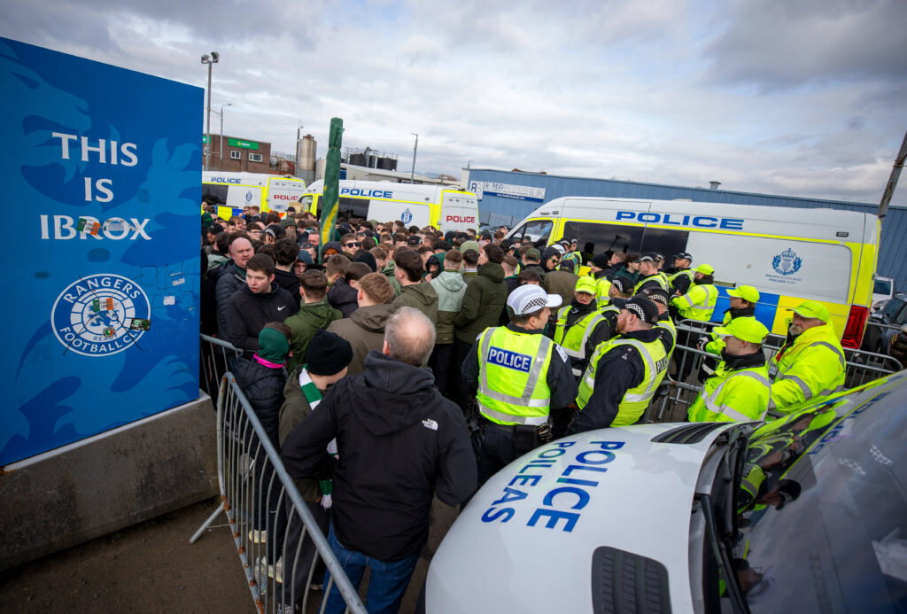 Scottish FA publish independent review on Ibrox disorder at Scottish Cup tie Celtic fans wait at the police cordon