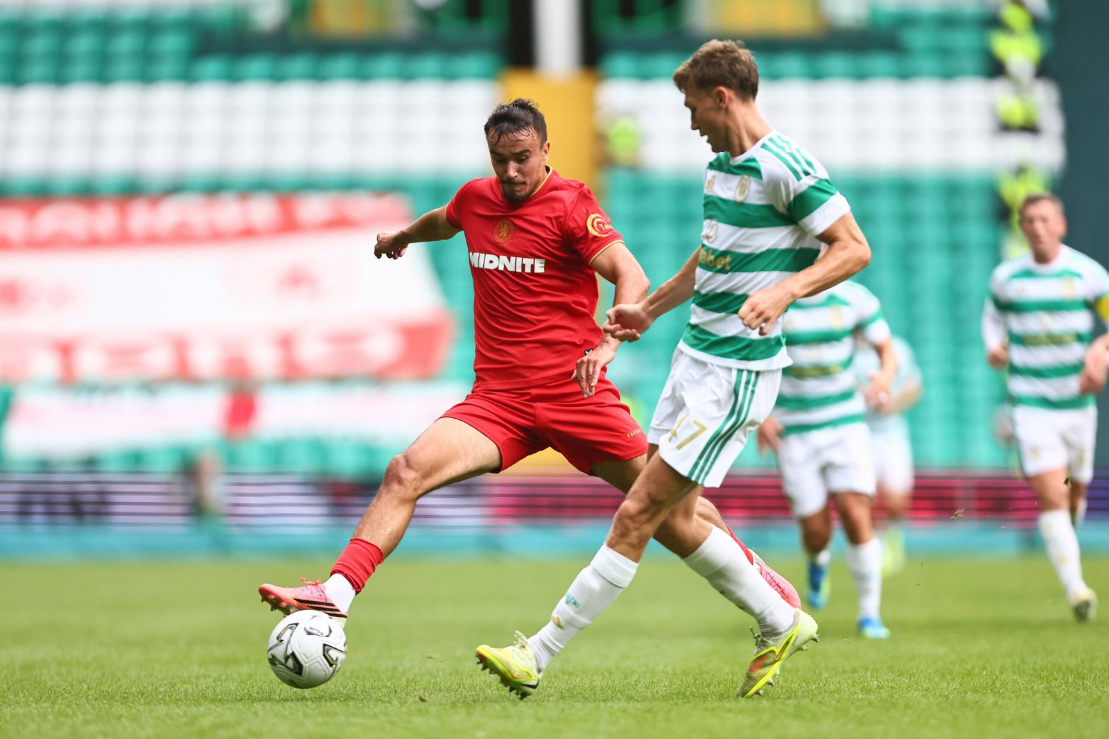 David Strelec of Middlesbrough challenged by Dane Murray of Celtic.