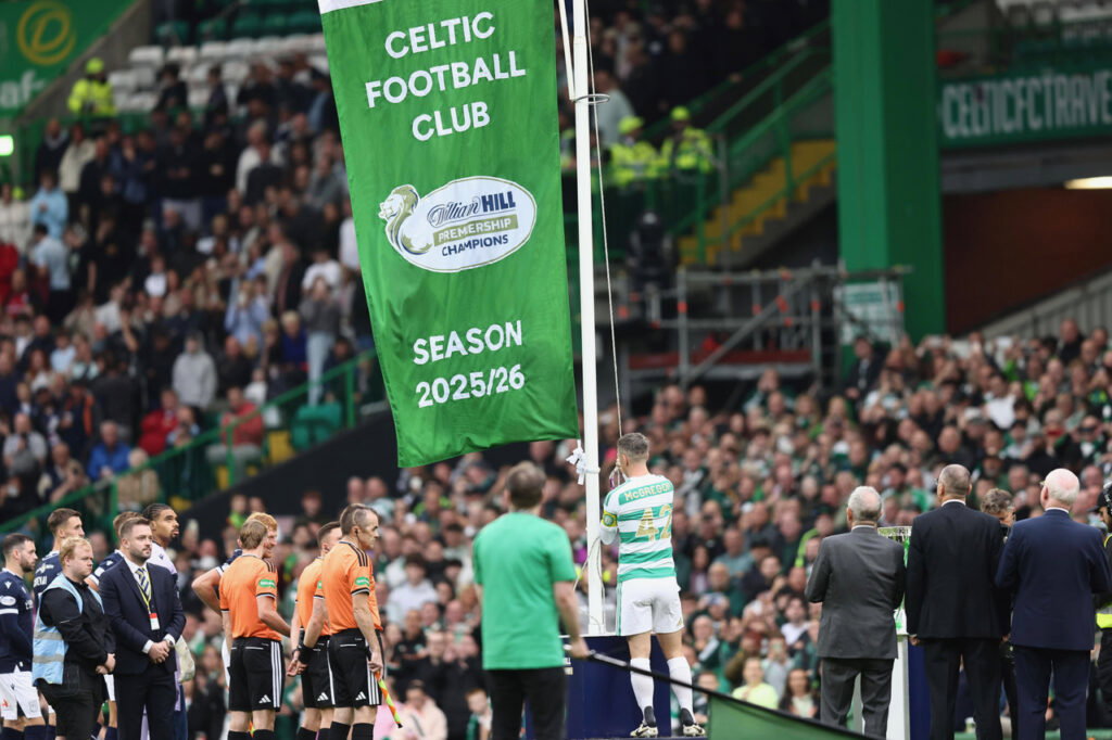 Callum McGregor raises the flag
