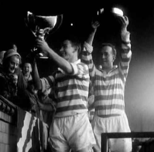 Celtic skipper Bertie Peacock lifts the League Cup after Hampden in the Sun, October 1957. Fellow Irish Celt Charlie Tully raises the plinth!