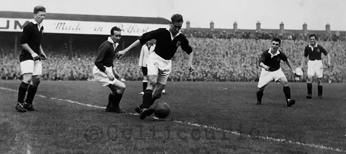 Belfast, October 1951. Bertie (second right) making his Irish debut alongside Celtic teammate Charlie Tully (second left) and against Bobby Evans (extreme left) at a packed Windsor Park.