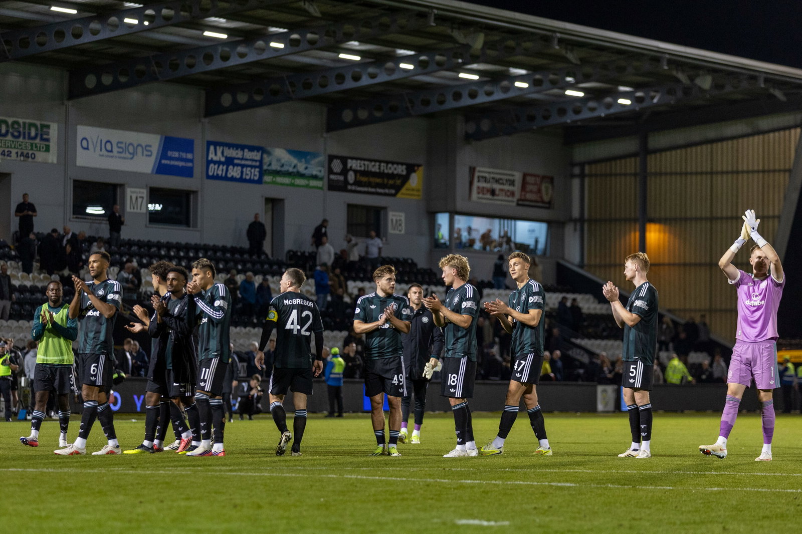 Celtic players applaud the fans 