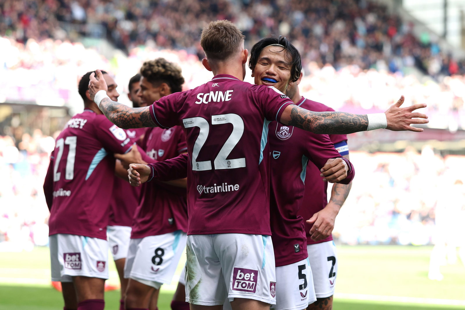 Reo Hatate of Burnley celebrates his assist