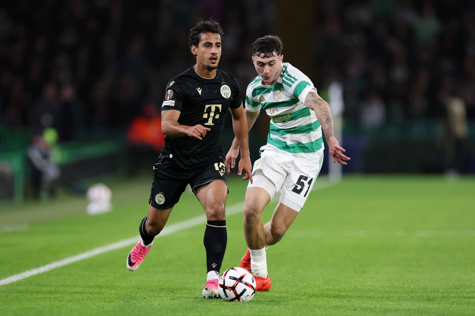 Daniel Arzani of Ferencvaros is challenged by Colby Donovan of Celtic 