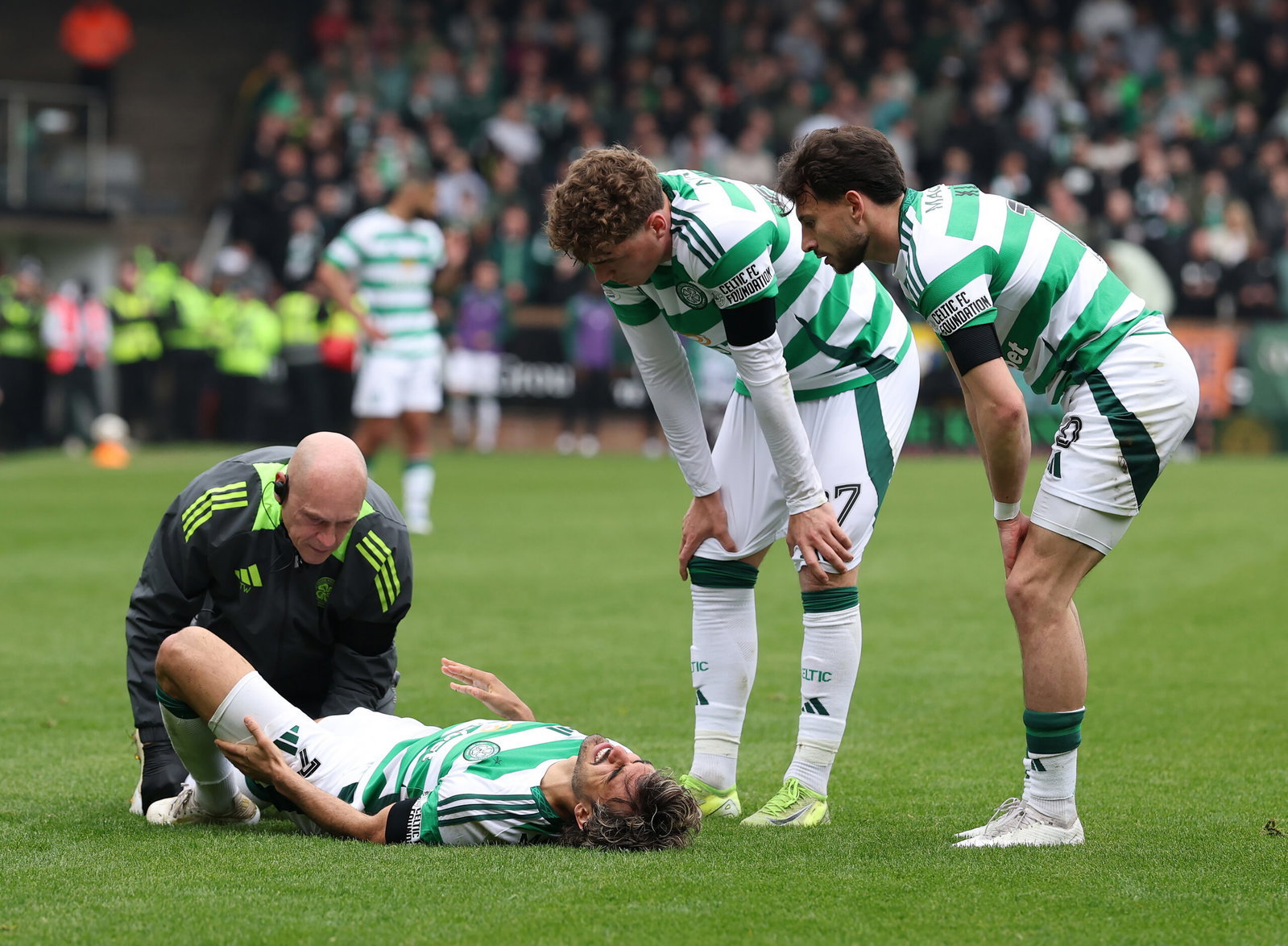 Jota of Celtic receives treatment