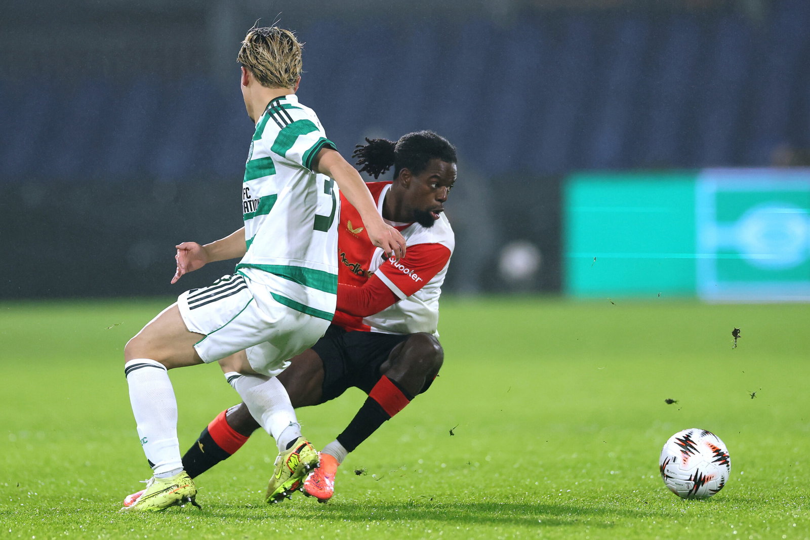 Jordan Lotomba of Feyenoord gets past the tackle from Daizen Maeda of Celtic