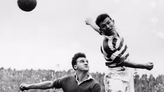 Bertie Peacock wins an aerial duel against Rangers.